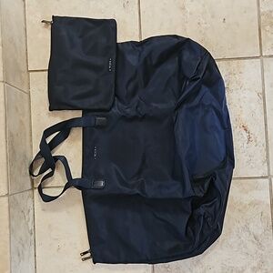 Tumi Bag Dark Blue with Trolly Pass Thru